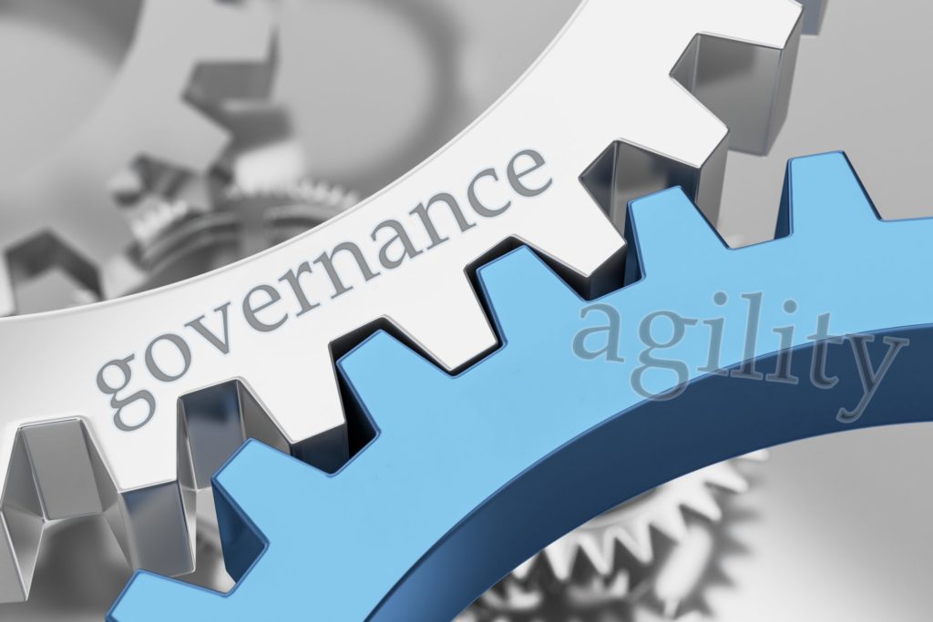 Interlocking gears that say "governance" and "agility"