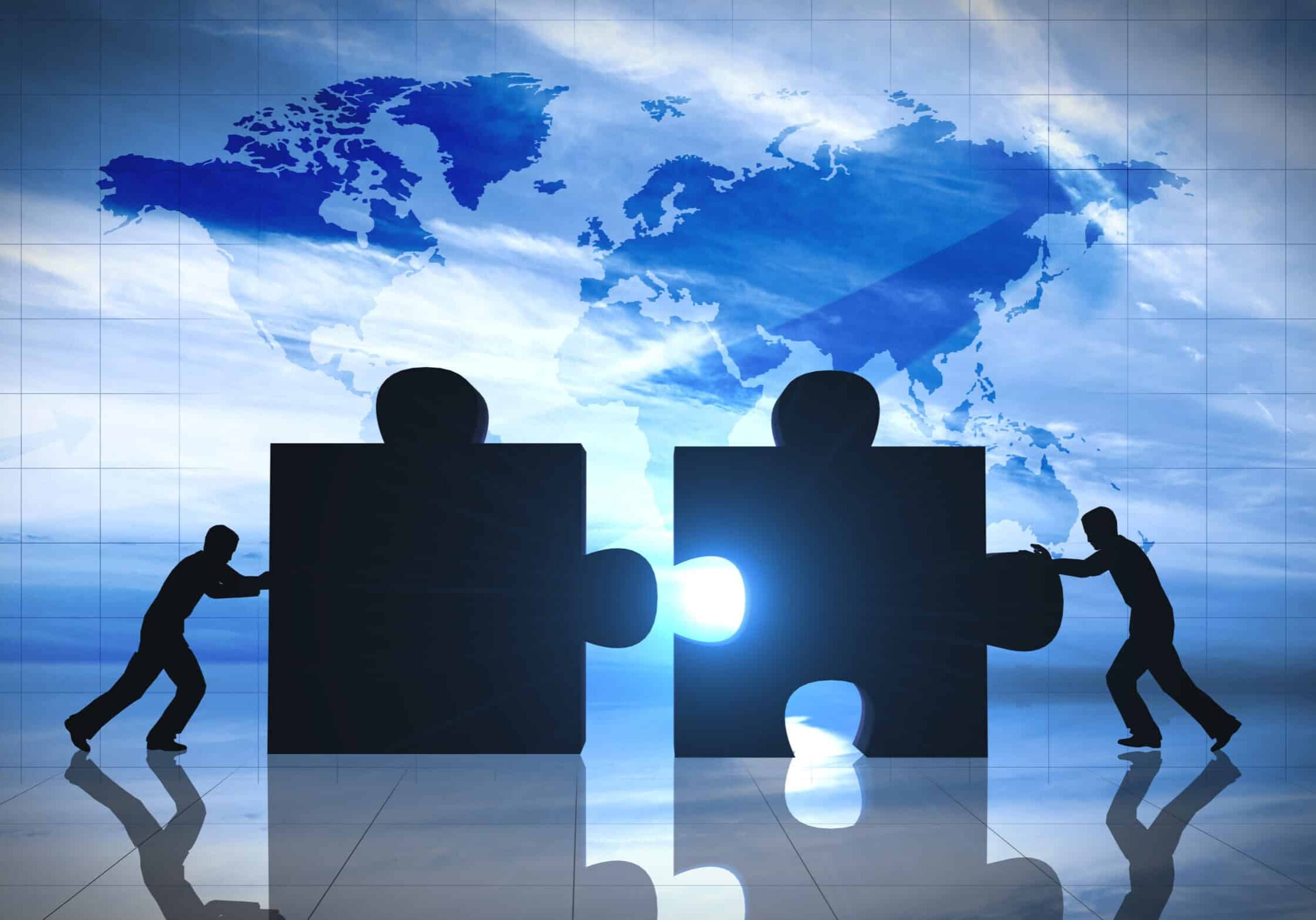 World Business teamwork puzzle pieces