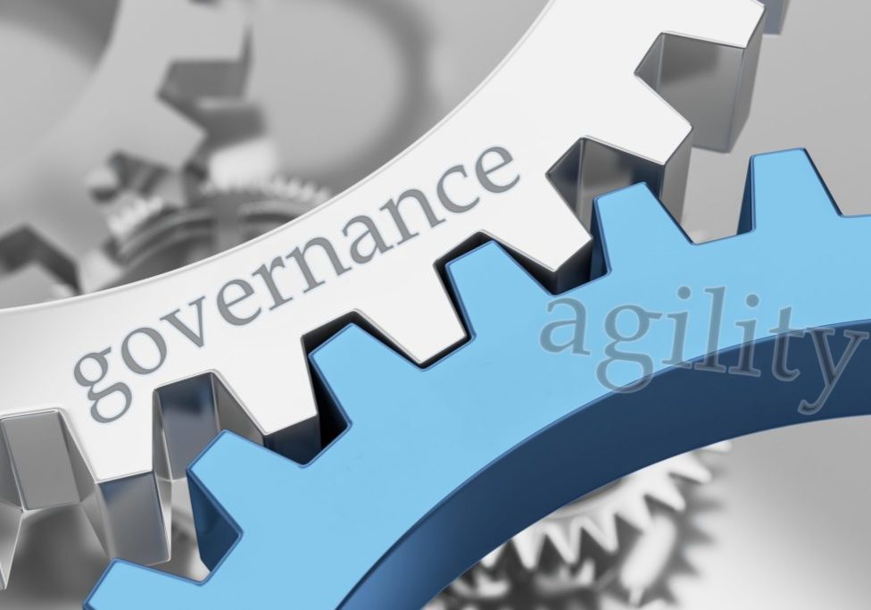 Interlocking gears that say "governance" and "agility"
